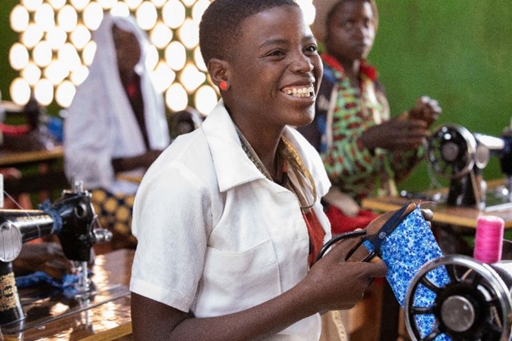 Complementary Basic Education graduate learning sewing skills, Malawi